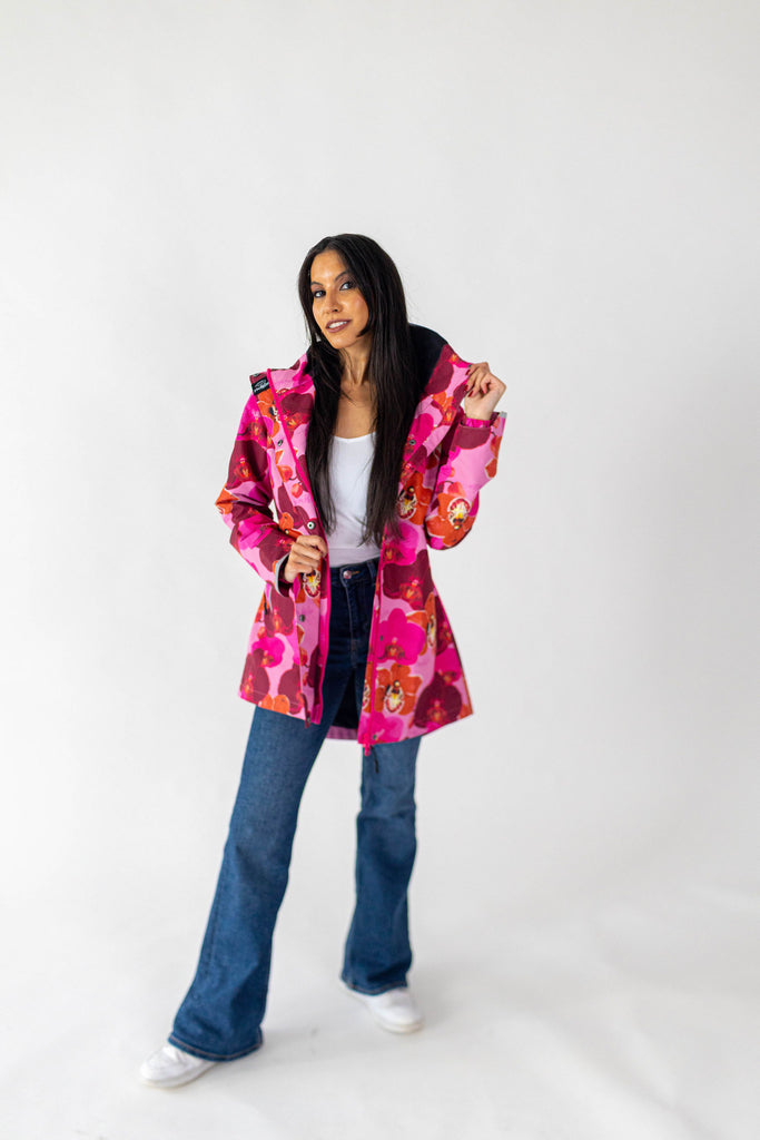 Orquidea Scribbler mesh-lined rain jacket, pink orchid floral print, raincoat, colourful printed rain wear, waterproof jacket for women, lightweight, plus size raincoat, New Zealand design, PFA free, recycled plastic fabrics.