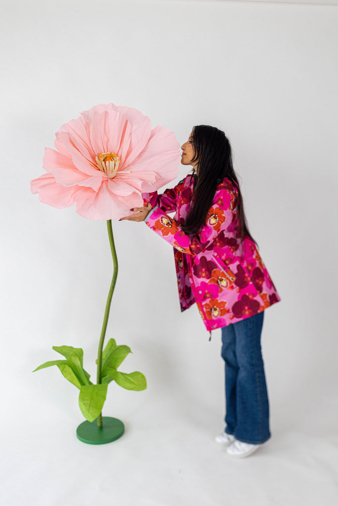 Orquidea Scribbler mesh-lined rain jacket, pink orchid floral print, raincoat, colourful printed rain wear, waterproof jacket for women, lightweight, plus size raincoat, New Zealand design, PFA free, recycled plastic fabrics.