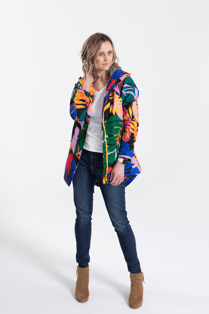 Scribbler rainwear, waterproof raincoat for women, rain jacket for ladies, outerwear, waterproof, mesh lined, lightweight, recycled plastic, sustainable fashion, winter coat, tropical Carnaval print, carnival print, mesh lined, beautiful, colourful print, breathable, packable coat, NZ, New Zealand designer, plus size, curvy, curves, mustard yellow, pink, blue, green