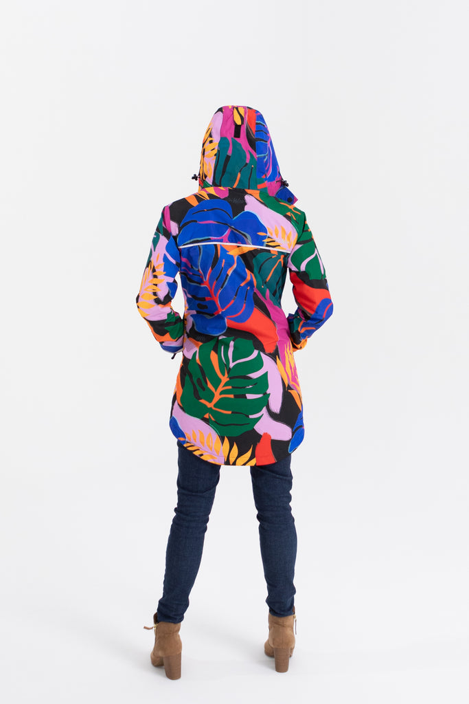 Scribbler rainwear, waterproof raincoat for women, rain jacket for ladies, outerwear, waterproof, mesh lined, lightweight, recycled plastic, sustainable fashion, winter coat, tropical Carnaval print, carnival print, mesh lined, beautiful, colourful print, breathable, packable coat, NZ, New Zealand designer, plus size, curvy, curves, mustard yellow, pink, blue, green