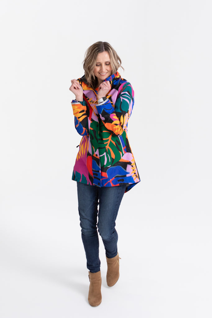Scribbler rainwear, waterproof raincoat for women, rain jacket for ladies, outerwear, waterproof, mesh lined, lightweight, recycled plastic, sustainable fashion, winter coat, tropical Carnaval print, carnival print, mesh lined, beautiful, colourful print, breathable, packable coat, NZ, New Zealand designer, plus size, curvy, curves, mustard yellow, pink, blue, green