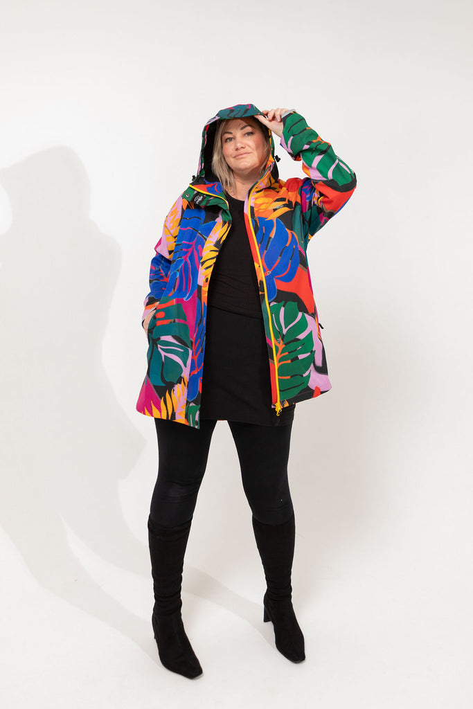 Carnaval fleece bonded womens waterproof raincoat, yellow, mustard, cobalt blue, magenta pink, plus size, NZ design, rain jacket, waterproof parka, winter coat, travel, wind proof, Scribbler, floral coat, USA winter coat, Canada waterproof winter parka, carinval print, colourful rain jacket, colourful raincoat, colourful coat, tropical