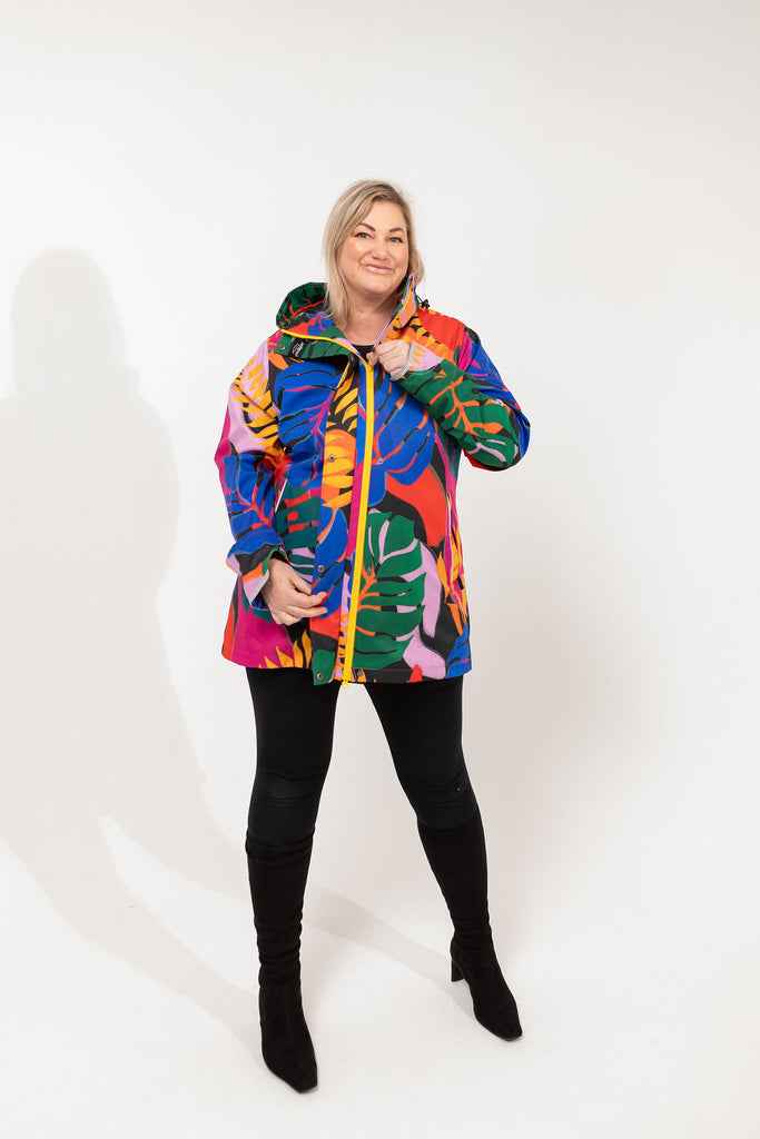 Carnaval fleece bonded womens waterproof raincoat, yellow, mustard, cobalt blue, magenta pink, plus size, NZ design, rain jacket, waterproof parka, winter coat, travel, wind proof, Scribbler, floral coat, USA winter coat, Canada waterproof winter parka, carinval print, colourful rain jacket, colourful raincoat, colourful coat, tropical