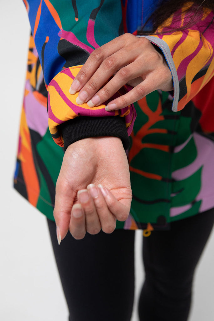 Carnaval fleece bonded womens waterproof raincoat, yellow, mustard, cobalt blue, magenta pink, plus size, NZ design, rain jacket, waterproof parka, winter coat, travel, wind proof, Scribbler, floral coat, USA winter coat, Canada waterproof winter parka, carinval print, colourful rain jacket, colourful raincoat, colourful coat, tropical