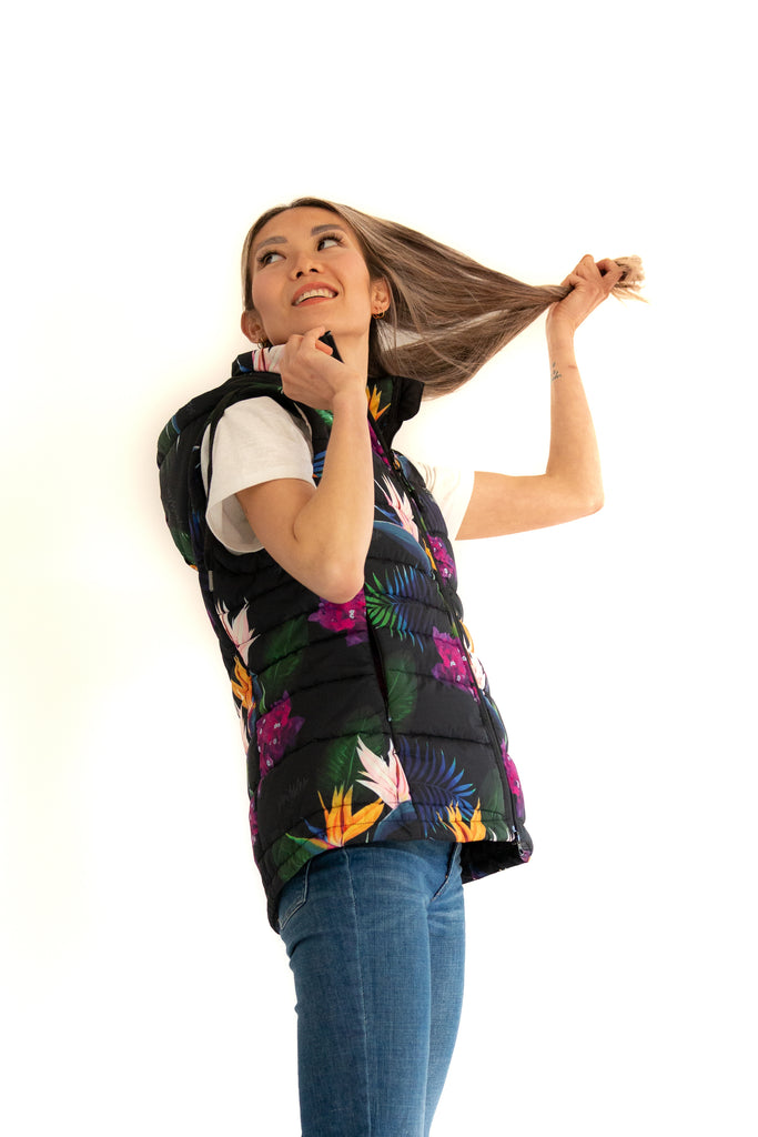Scribbler paradiso vest, tropical print, black colourful puffer vest, waterproof gilet, recycled fabric, recycled puffer, conscious fashion, plus size vest, floral vest, removable hood, tropical print, printed vest, colourful vest, black puffer vest, quilted vest, plus size vest, NZ, New Zealand, Australia, USA